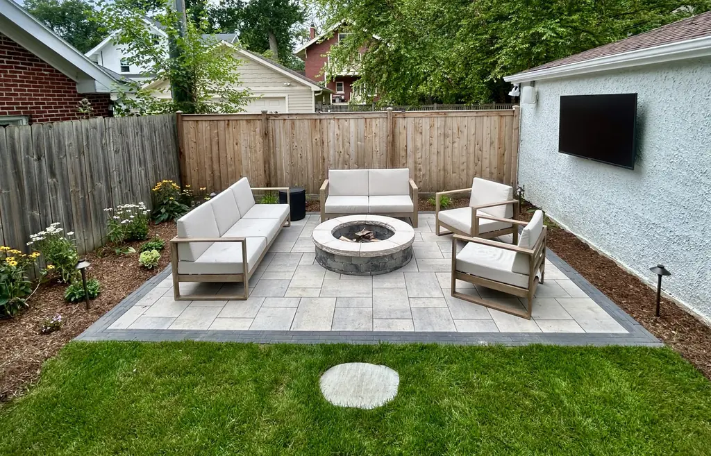 Fire pit with outdoor seating on a new paver patio