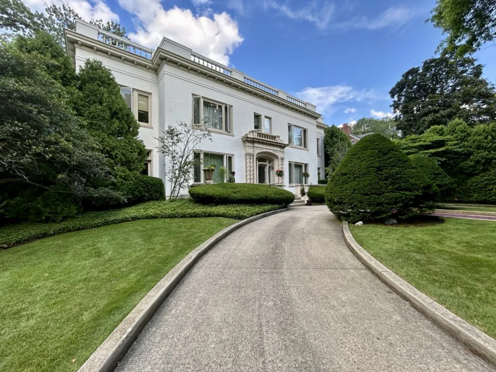 Lush green lawn along the driveway of a North Shore home